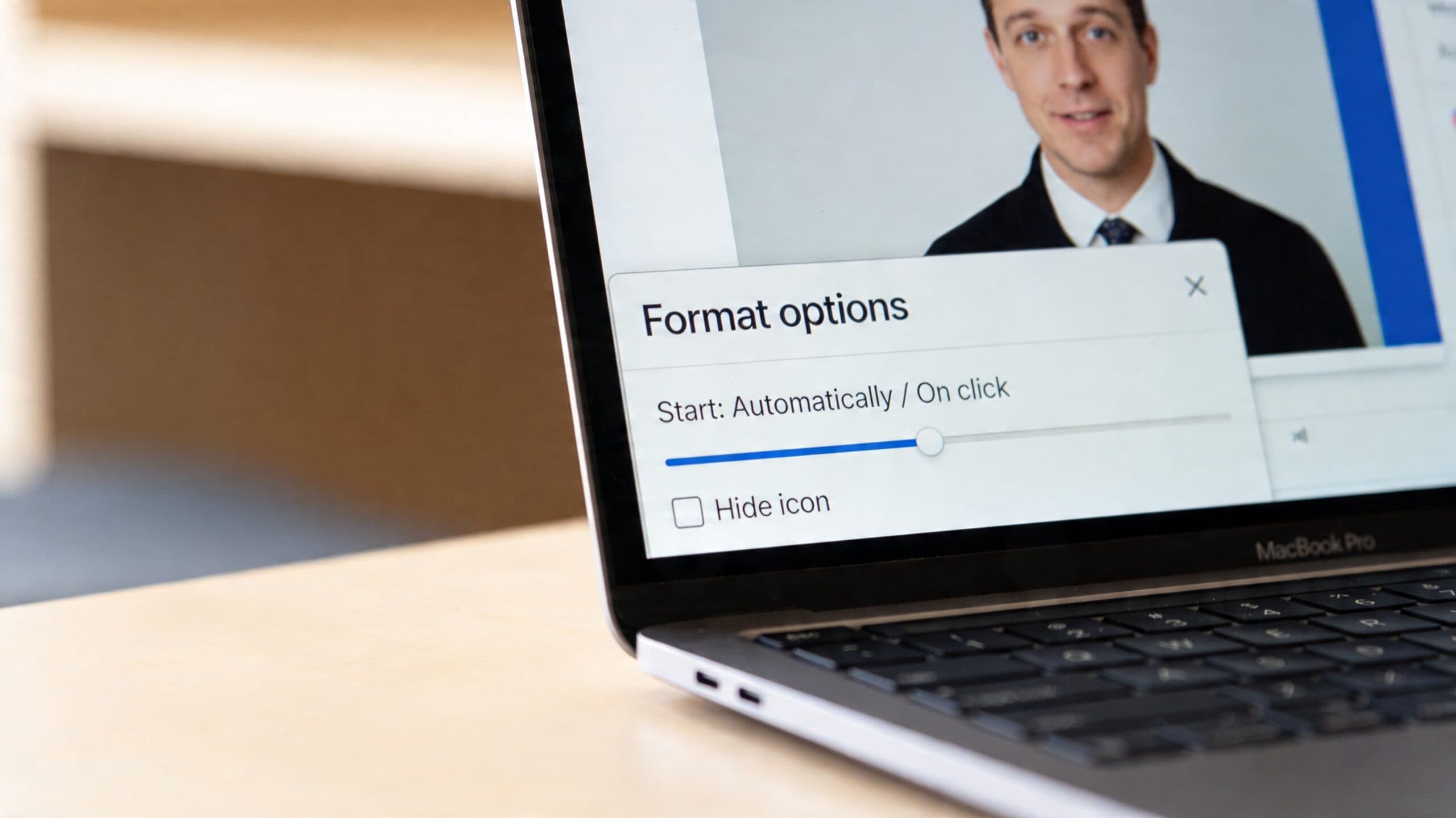 A close-up view of a MacBook screen showing Google Slides Format options for a video presentation.