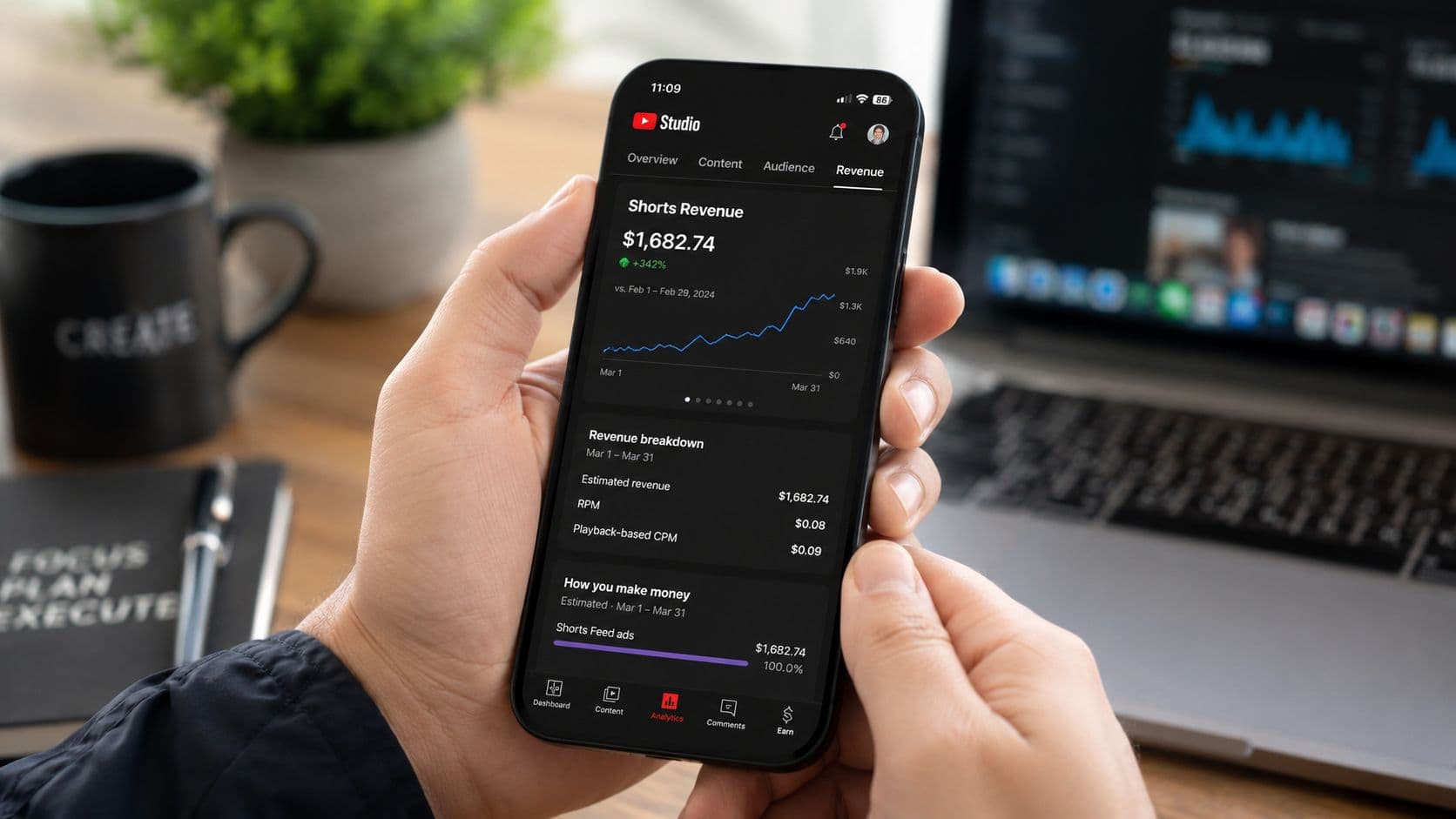 A person holding a smartphone displaying YouTube Studio analytics showing earnings from YouTube Shorts revenue.